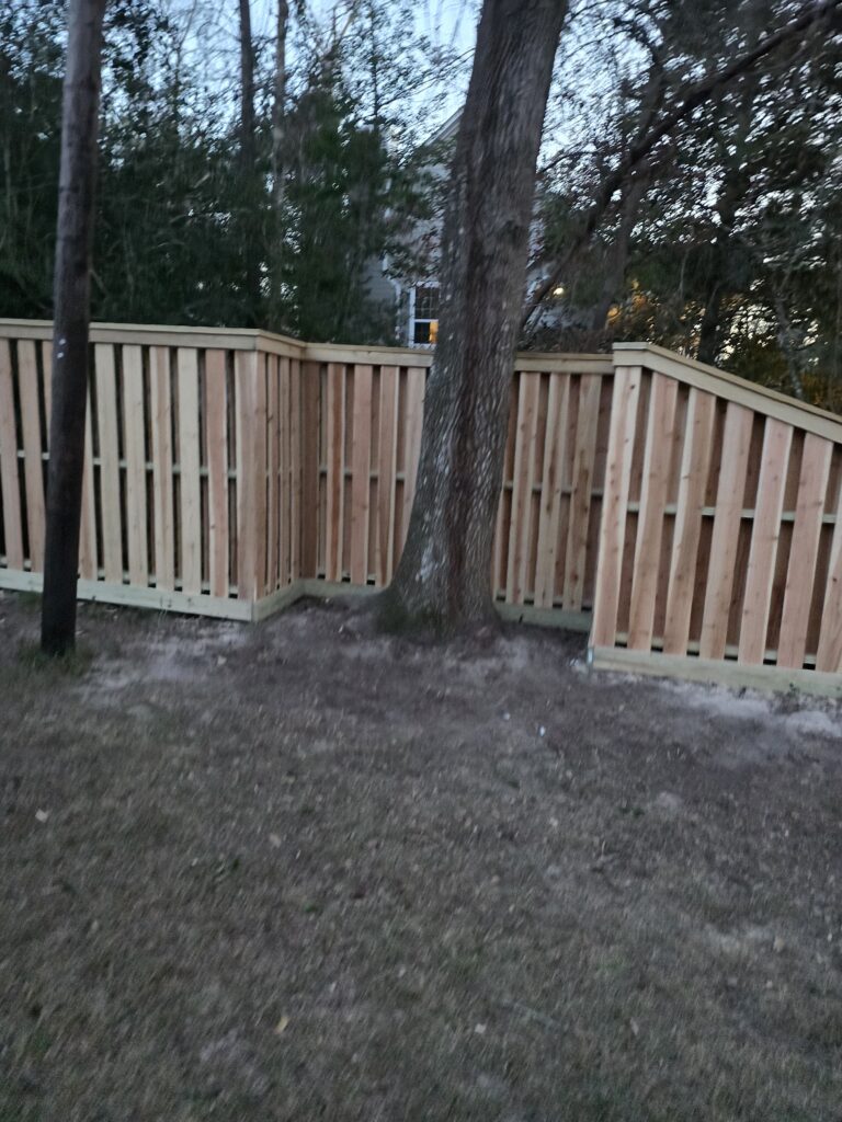 Cedar shadowbox fence installed around a tree.