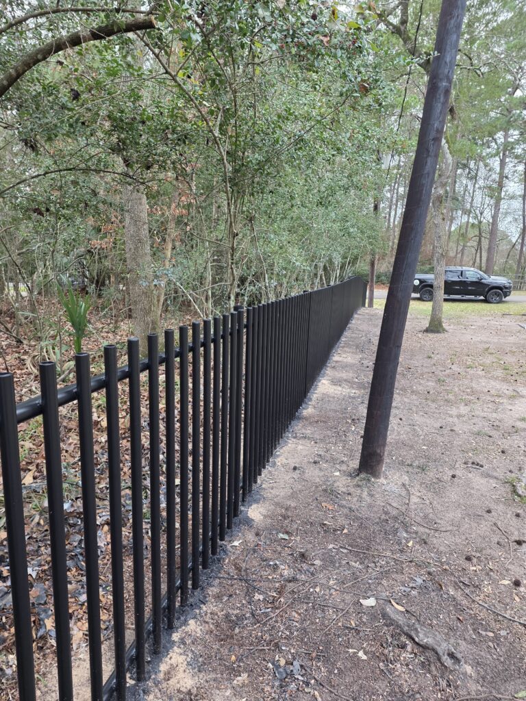 Black metal security fence installation.