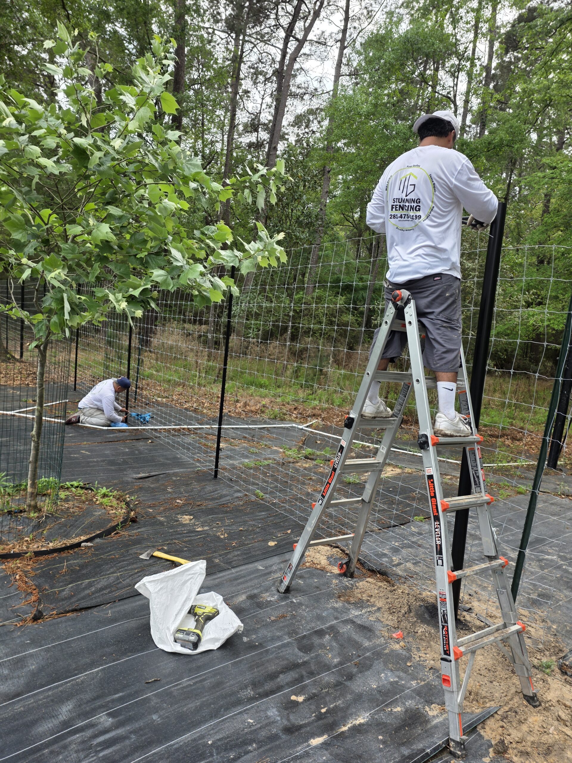 Professional 8ft high deer fence installation by Stunning Fence in Magnolia, TX.
